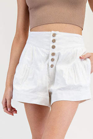 White pleated button down shorts