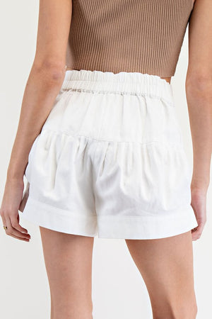 White pleated button down shorts